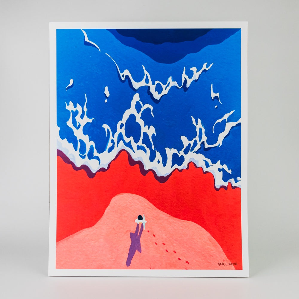 Art print of a stylized landscape with overhead view of blue tide, red beach, and a figure standing observing.