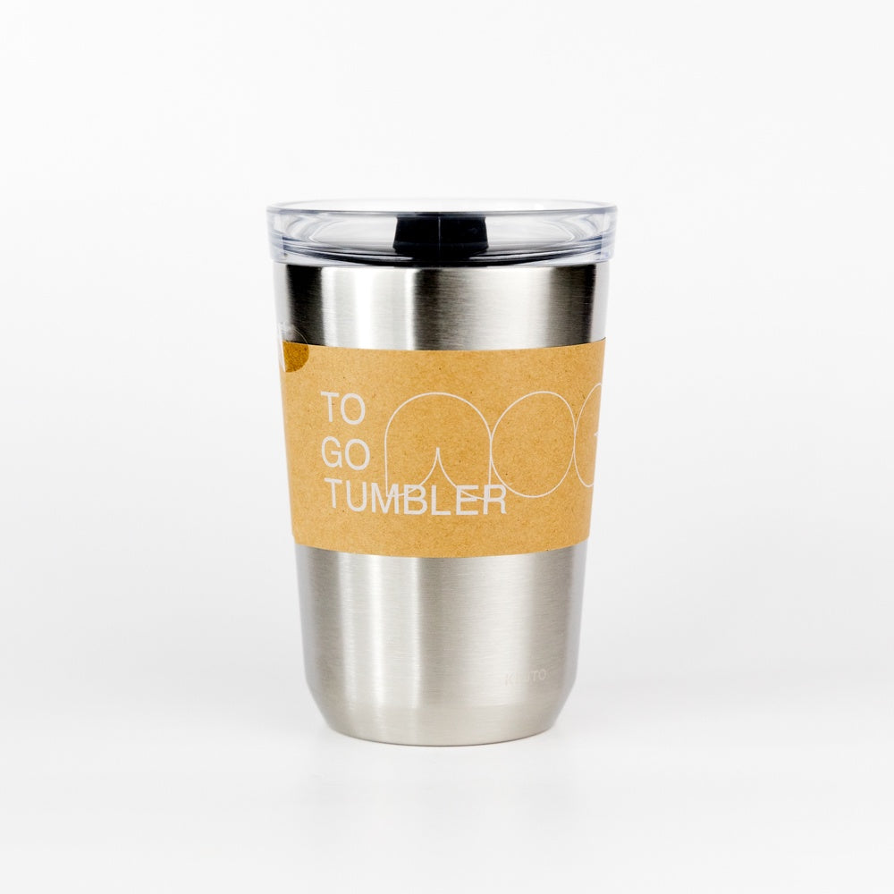 Stainless steel tumbler with a brown sleeve on a white background