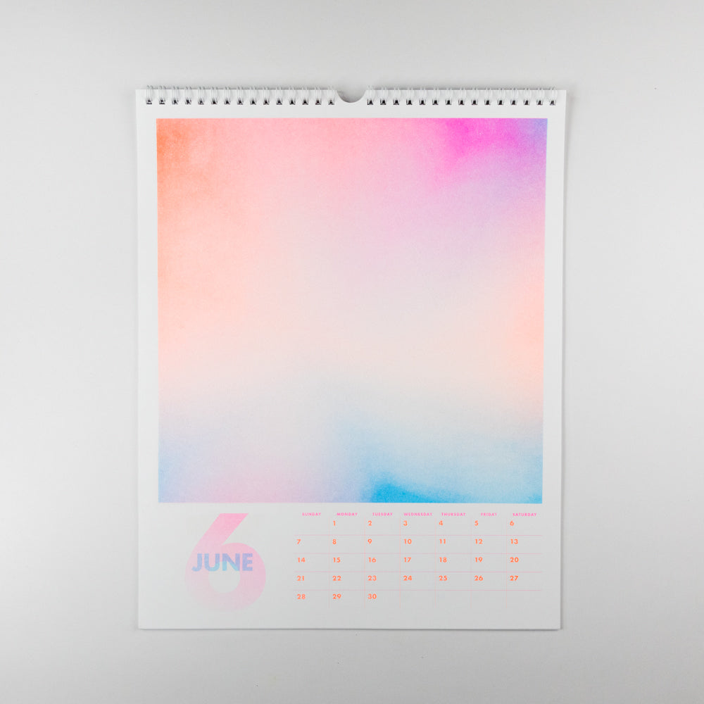 Calendar with a colorful gradient design on a white background
