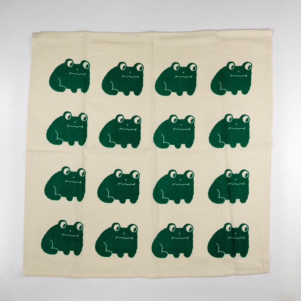 Tea towel with black frog design and 'Nice Life' text on a beige background