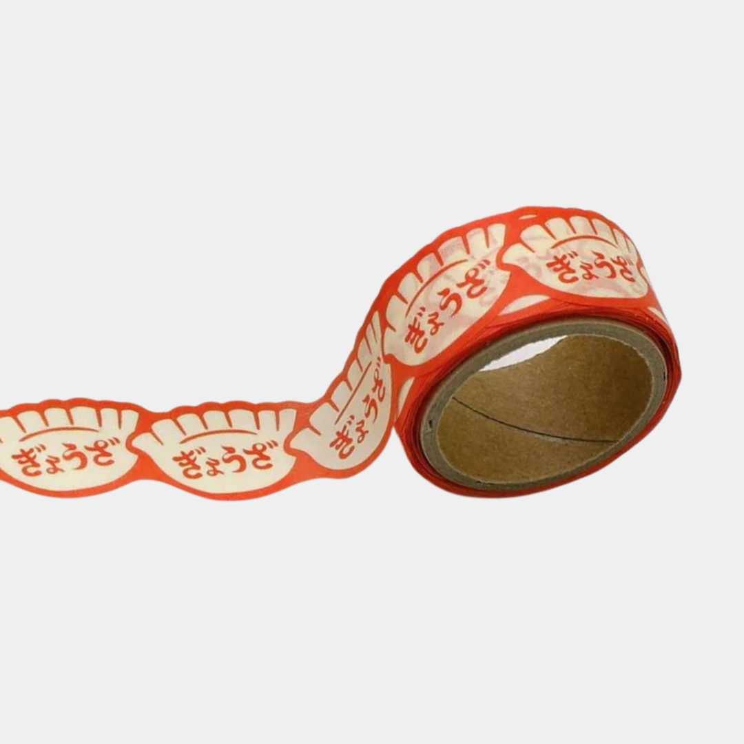 Roll of decorative tape with red and white design on a white background
