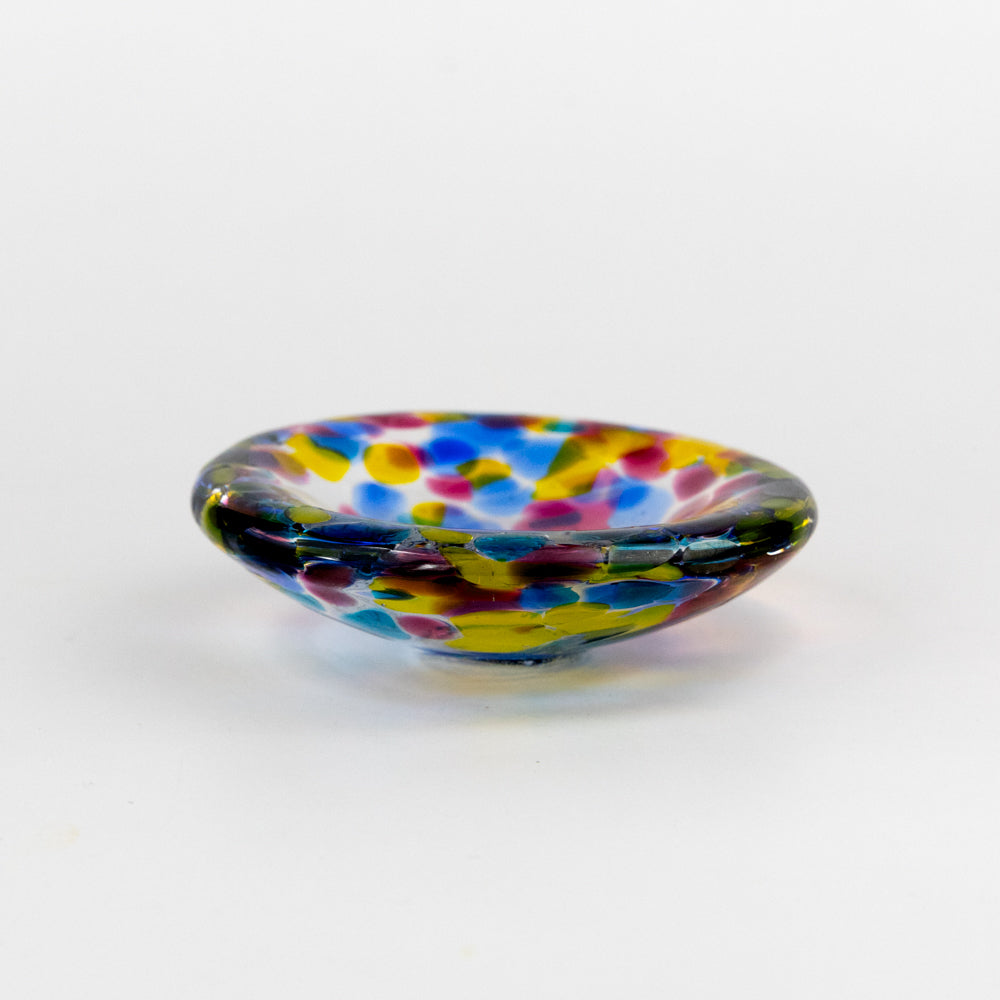 Multicolored glass bowl on a white background