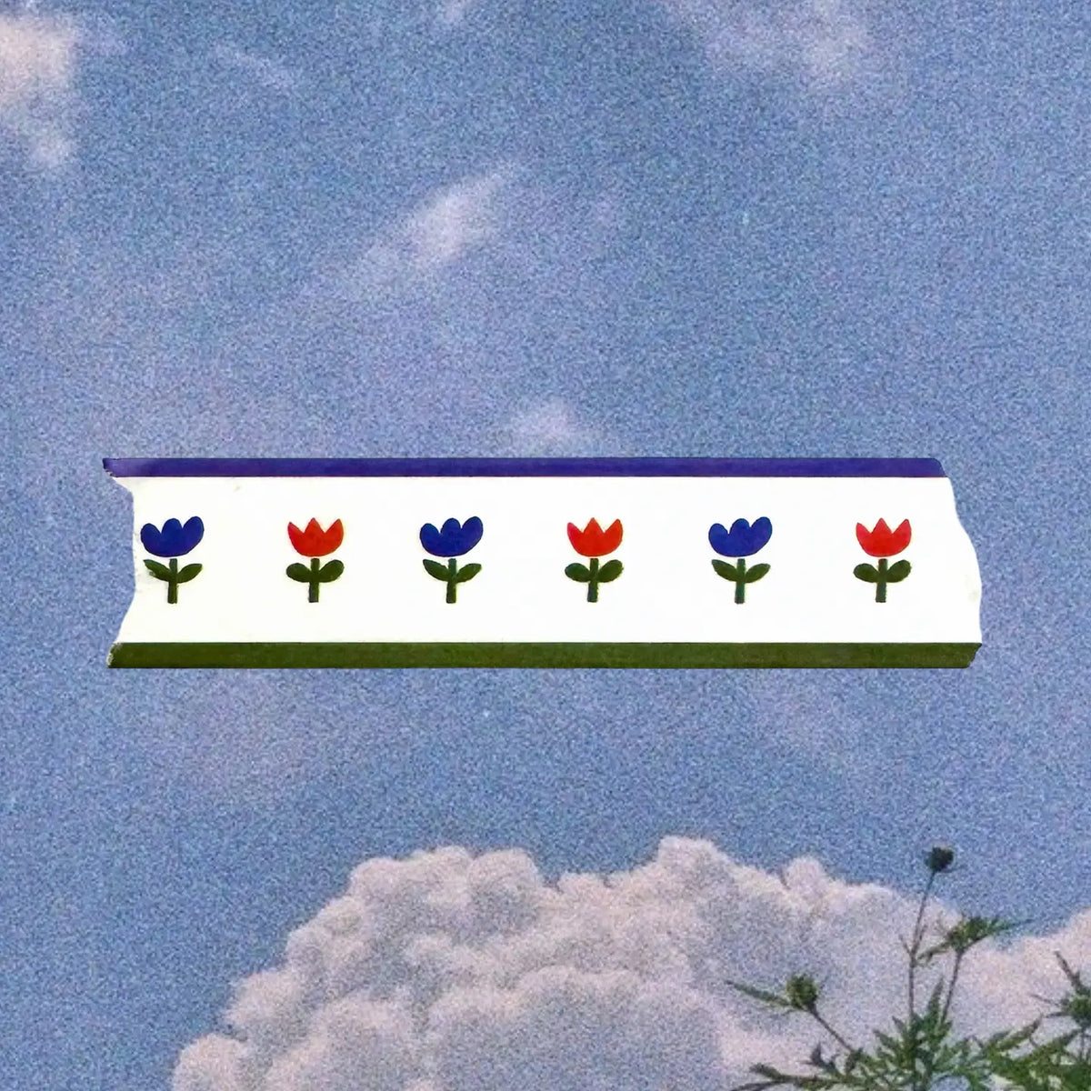 Roll of washi tape with decorative design on a white background